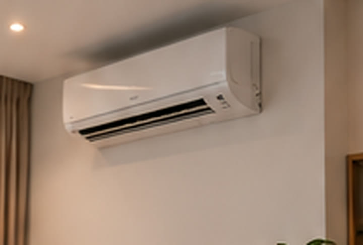 Wall-mounted aircon running in an empty room